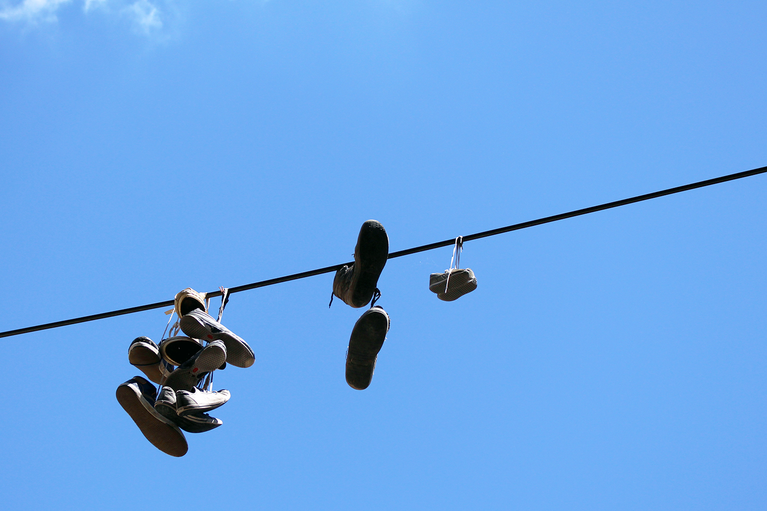 Travelettes » Shoes hanging over power cables in Ljubljana | Travelettes